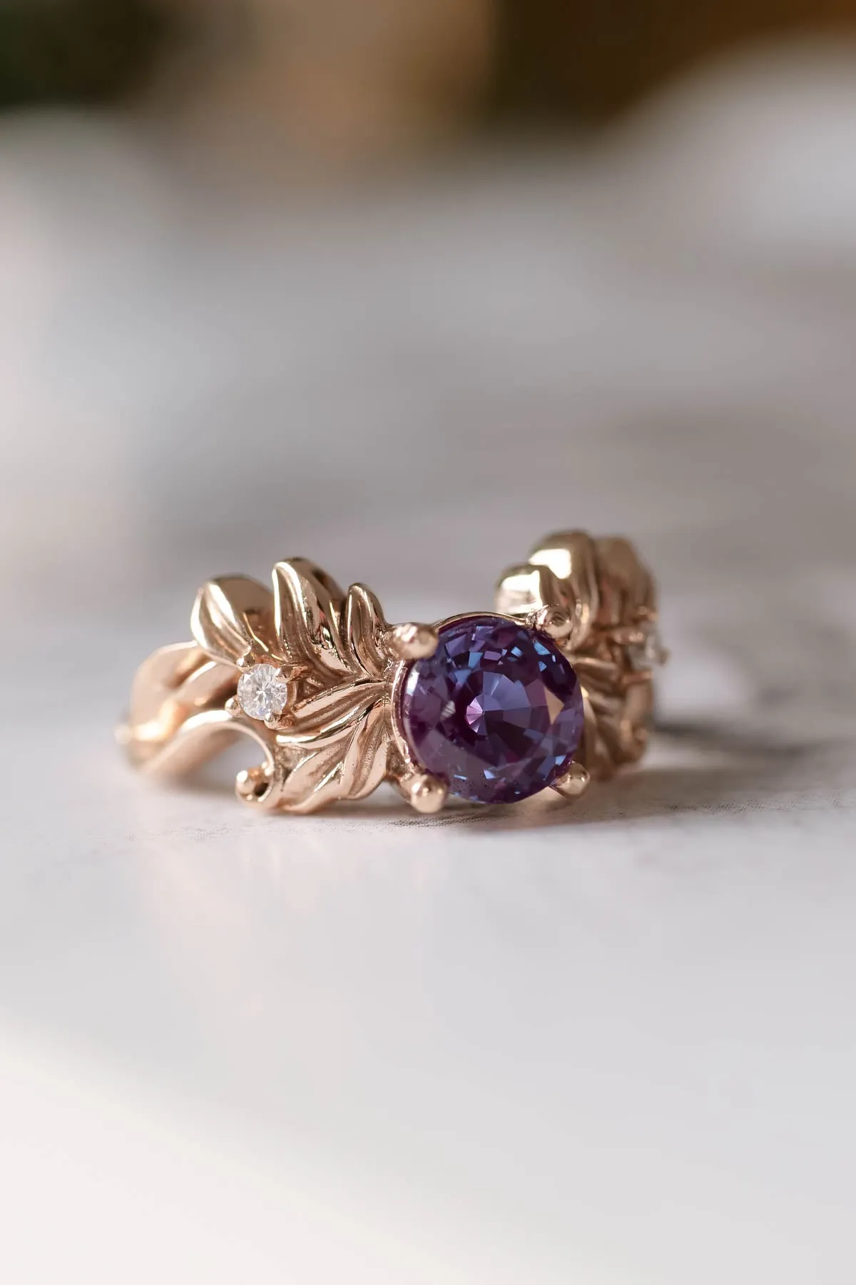 Nature themed engagement ring with alexandrite, colour changing gemstone